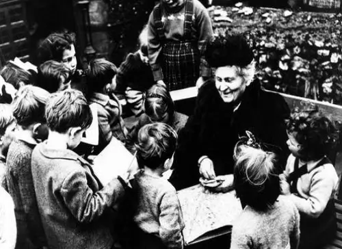 Children working with Montessori materials at their own pace